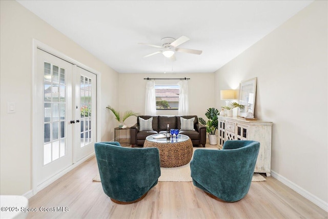 6315 Anchor Ln, Rockledge, FL 32955 - living room featuring french doors, light wood-style flooring, and a ceiling fan