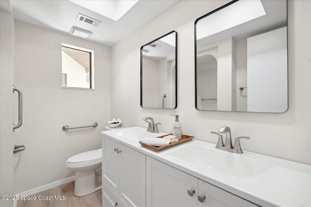 6315 Anchor Ln, Rockledge, FL 32955 - bathroom with double vanity and wood finished floors