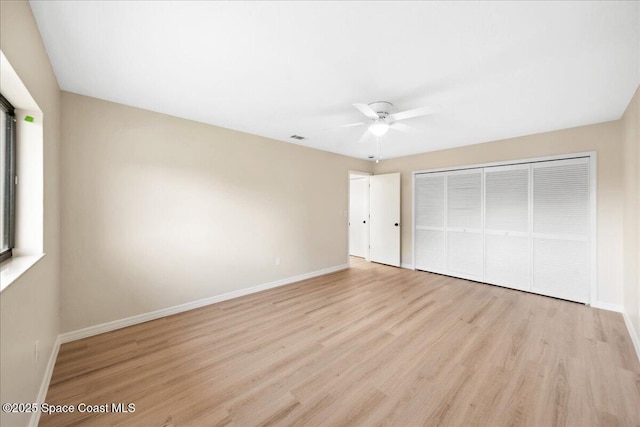 6315 Anchor Ln, Rockledge, FL 32955 - unfurnished bedroom featuring light wood-style floors, a closet, and a ceiling fan