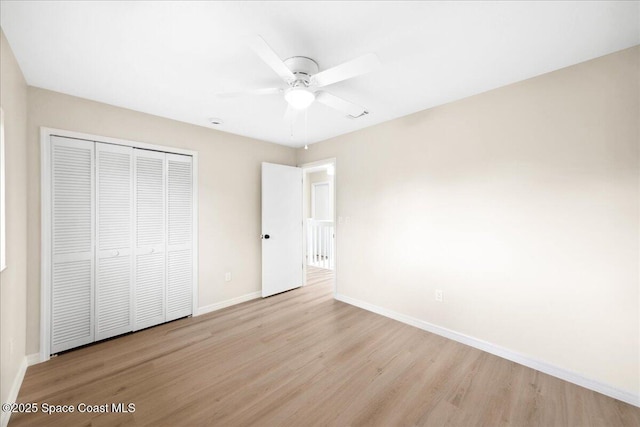 6315 Anchor Ln, Rockledge, FL 32955 - unfurnished bedroom featuring wood finished floors, a closet, and a ceiling fan