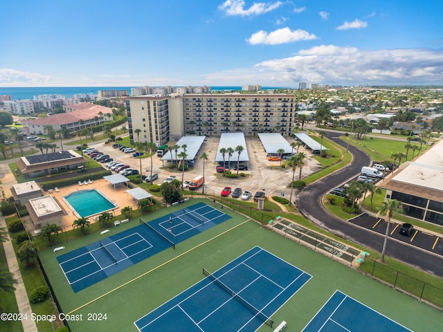 drone / aerial view featuring a water view and a city view