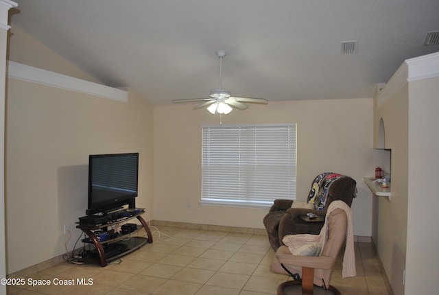 sitting room with light tile patterned floors, visible vents, vaulted ceiling, and a ceiling fan