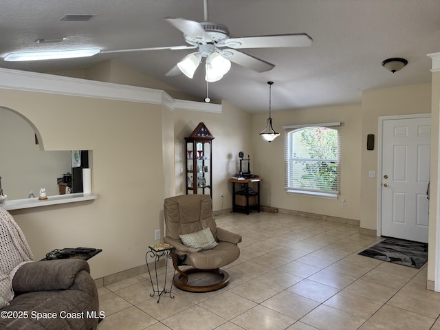 foyer featuring light tile patterned floors, baseboards, ceiling fan, and vaulted ceiling