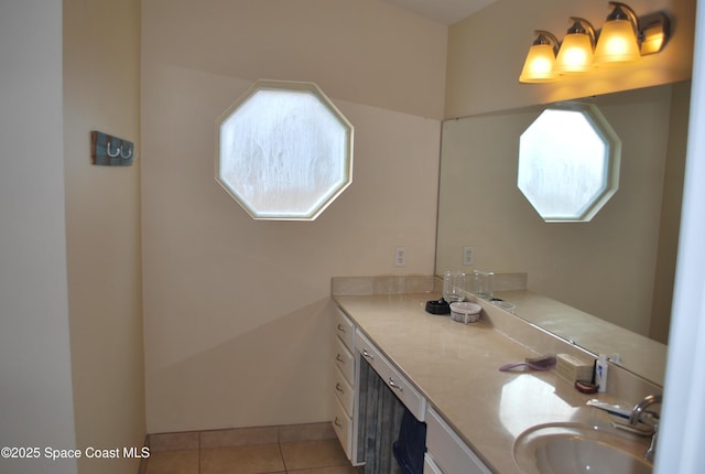 bathroom featuring tile patterned floors, baseboards, and vanity