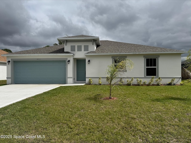 prairie-style home featuring a shingled roof, concrete driveway, stucco siding, an attached garage, and a front yard