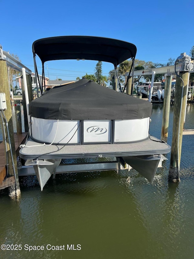 view of dock featuring a water view and boat lift