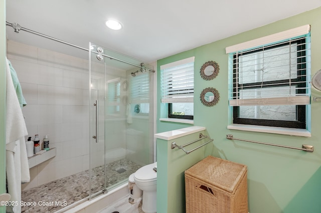 5055 Dixie Hwy NE Unit B206, Palm Bay, FL 32905 - full bathroom featuring a shower stall and toilet