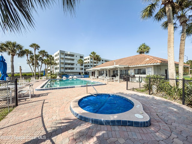 5055 Dixie Hwy NE Unit B206, Palm Bay, FL 32905 - community pool featuring a patio and a hot tub