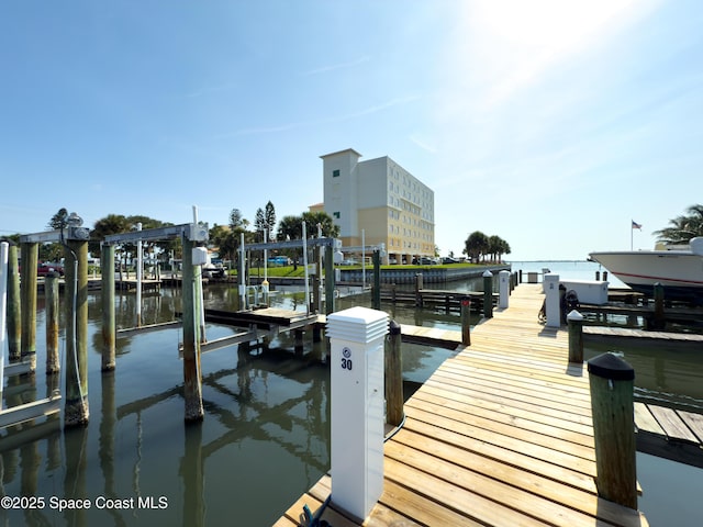 5055 Dixie Hwy NE Unit B206, Palm Bay, FL 32905 - dock featuring boat lift and a water view