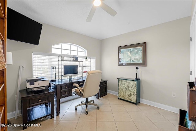 office area featuring light tile patterned flooring, baseboards, and ceiling fan