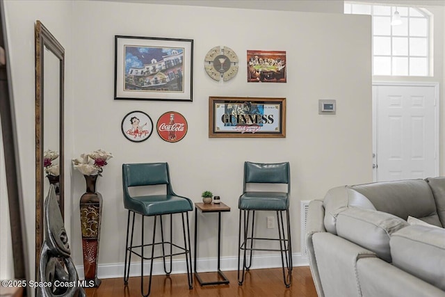 interior space featuring wood finished floors and baseboards