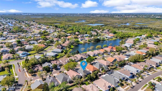 aerial view with a residential view and a water view