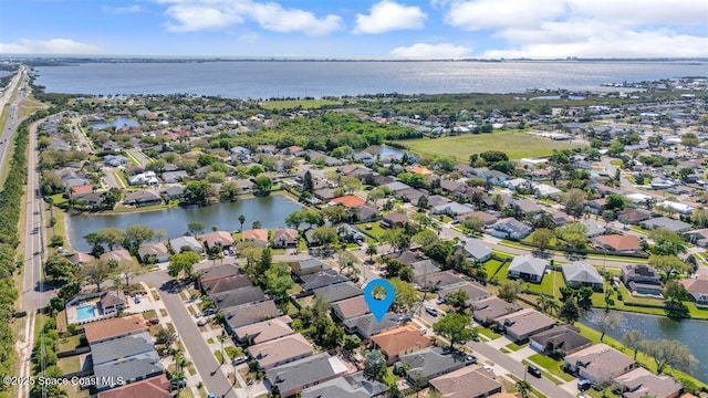 bird's eye view featuring a residential view and a water view