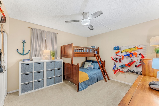 bedroom with light carpet, ceiling fan, a textured ceiling, and baseboards