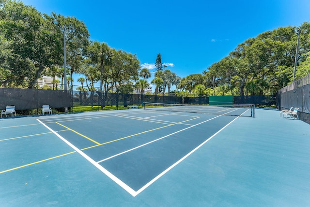 view of sport court with fence