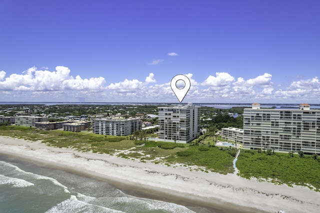 bird's eye view featuring a view of city, a water view, and a view of the beach