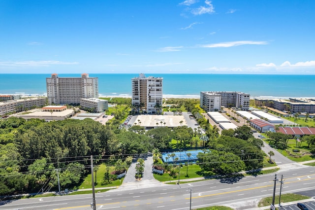 drone / aerial view featuring a water view and a city view