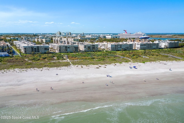 aerial view with a water view, a city view, and a view of the beach