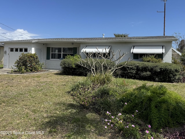 ranch-style house with an attached garage and a front yard