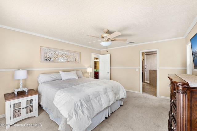bedroom featuring baseboards, ornamental molding, a textured ceiling, visible vents, and light colored carpet