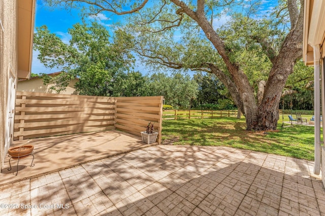 view of patio / terrace featuring fence