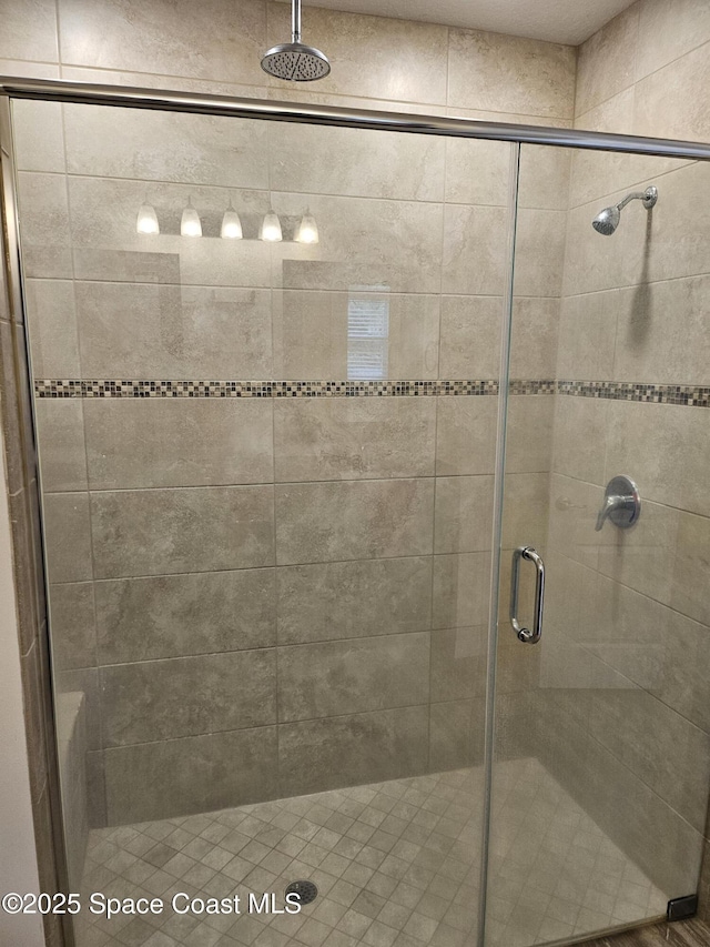 bathroom with a shower stall