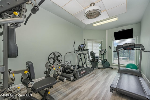 interior space featuring baseboards and wood finished floors