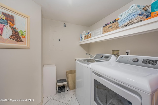 laundry area featuring laundry area, electric panel, marble finish floor, and washer and clothes dryer