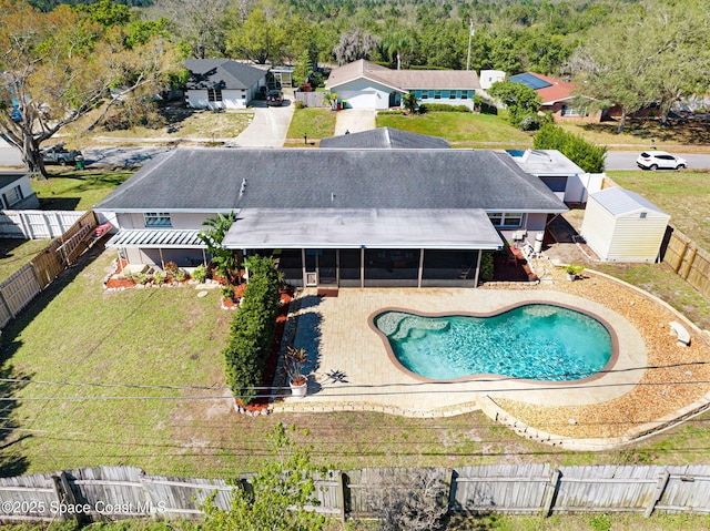 view of pool with a patio, a fenced backyard, a sunroom, and a fenced in pool