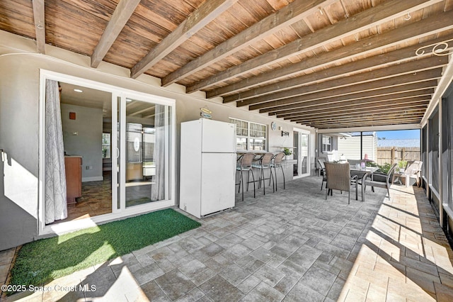 view of patio / terrace featuring outdoor dining area and fence