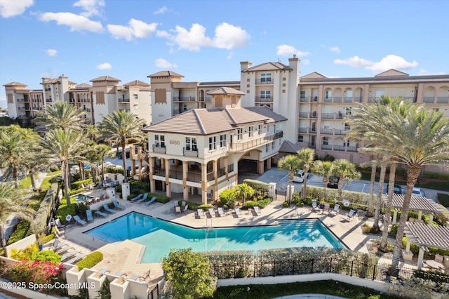 pool featuring a patio and fence