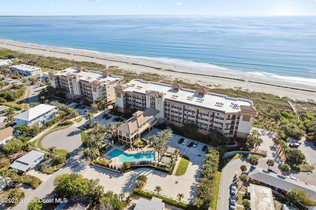 drone / aerial view with a view of the beach and a water view