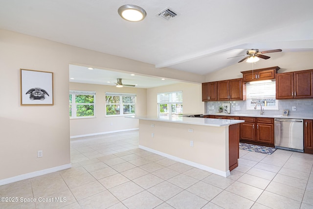 kitchen featuring light tile patterned floors, tasteful backsplash, visible vents, light countertops, and stainless steel dishwasher