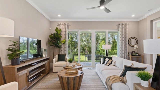 living area with ornamental molding, recessed lighting, and a ceiling fan