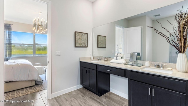 full bath featuring wood tiled floor, visible vents, a sink, and ensuite bath