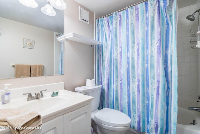 bathroom featuring shower / tub combo, vanity, and toilet