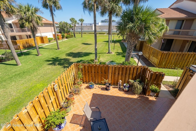 view of patio / terrace with a residential view and fence