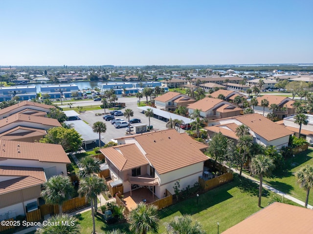 birds eye view of property featuring a residential view and a water view