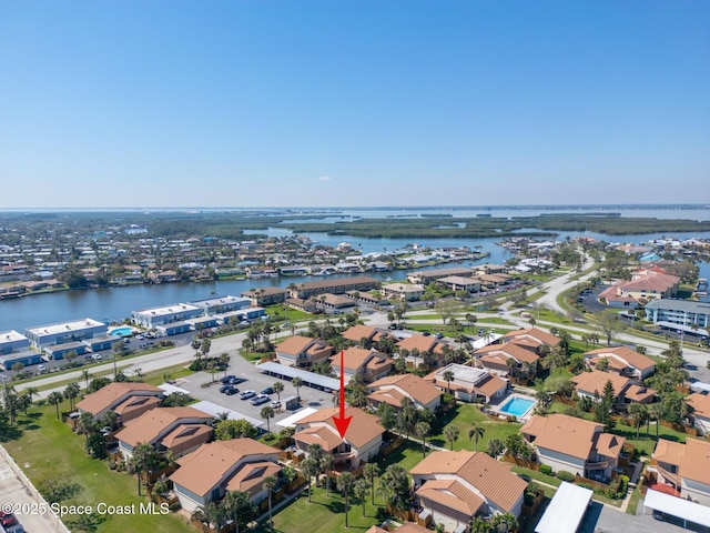 bird's eye view with a water view and a residential view