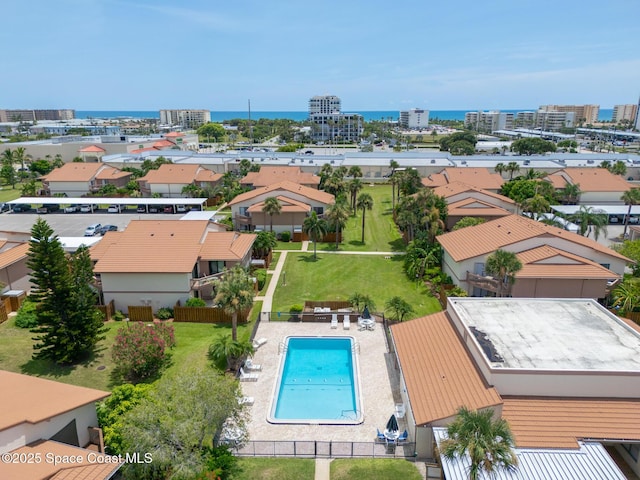 aerial view featuring a water view and a view of city