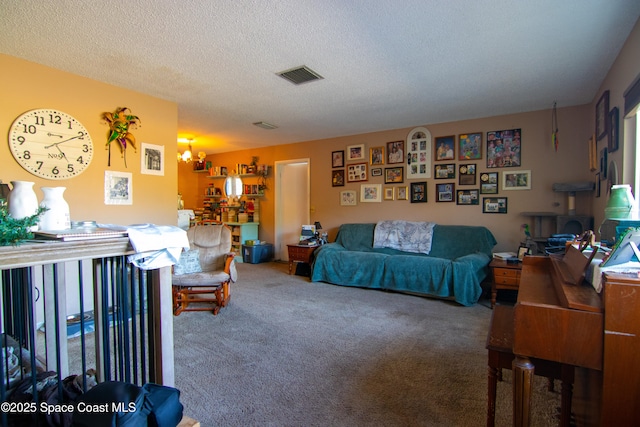 living area with a textured ceiling, carpet floors, and visible vents
