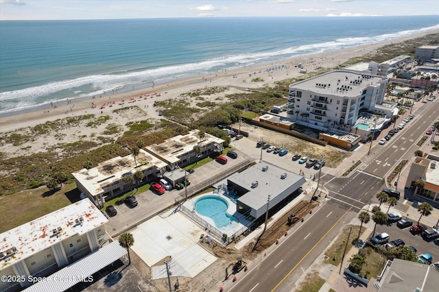 aerial view featuring a water view and a view of the beach