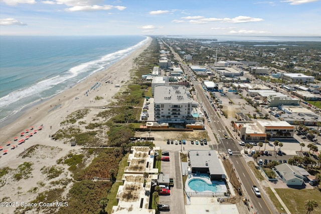 aerial view featuring a water view and a view of the beach