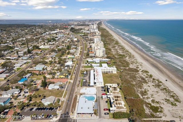 aerial view featuring a water view and a view of the beach