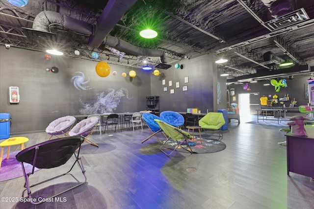 recreation room featuring wood finished floors