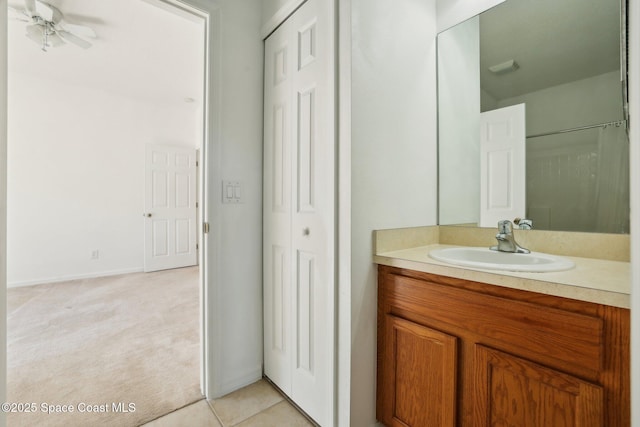 full bathroom with vanity, baseboards, and tile patterned flooring