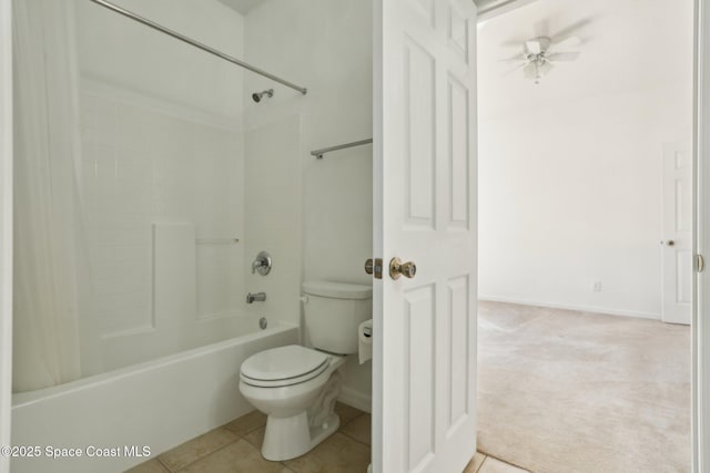 bathroom featuring baseboards, ceiling fan, tile patterned flooring, toilet, and shower / bathtub combination