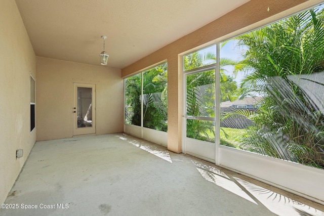 unfurnished sunroom with a wealth of natural light