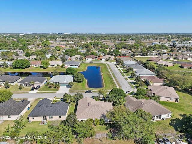 aerial view with a residential view and a water view