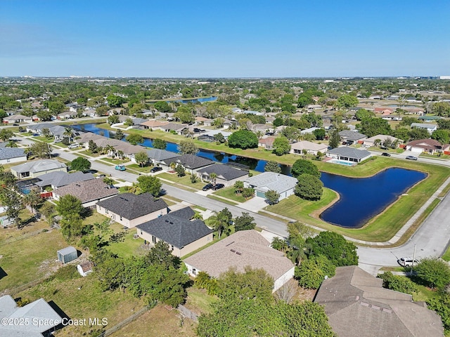 aerial view with a residential view and a water view